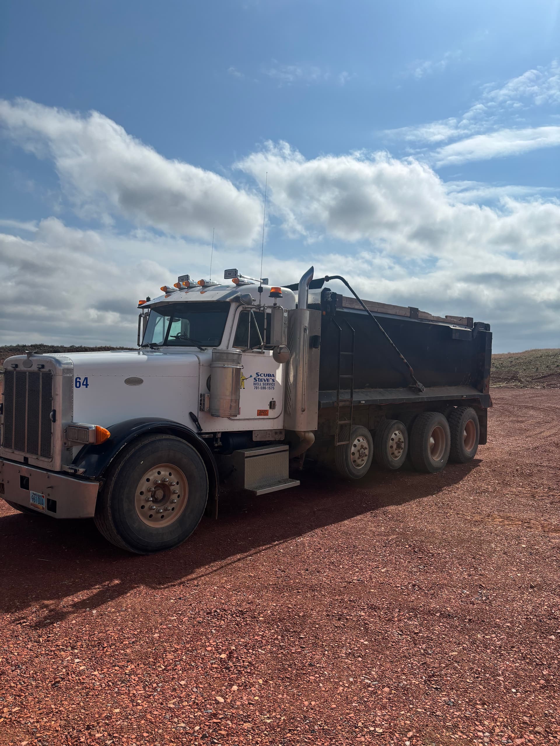 Large truck parked on scoria